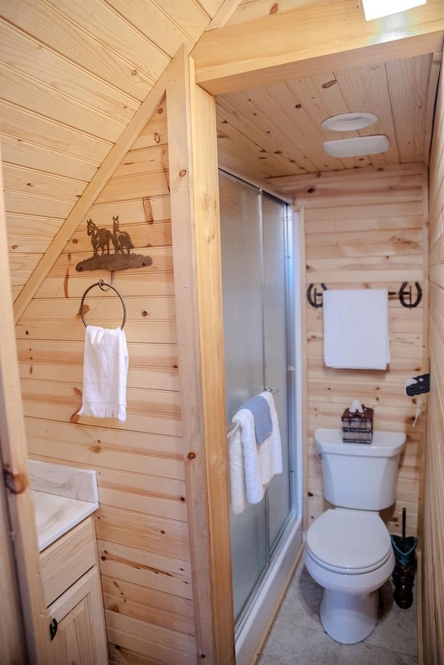 bathroom with toilet, wood walls, vanity, and wood ceiling