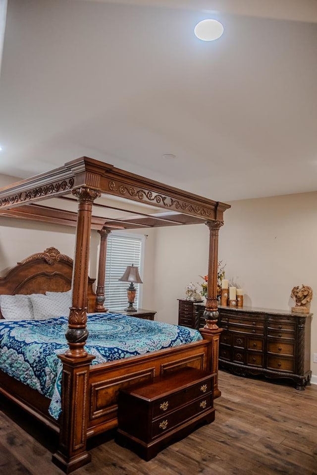 bedroom featuring dark wood-style flooring