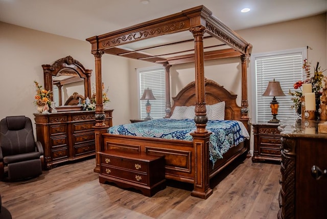 bedroom featuring light wood finished floors and recessed lighting