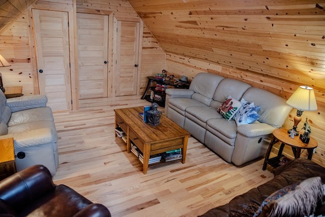 living room featuring light wood-style flooring, lofted ceiling, wooden ceiling, and wooden walls