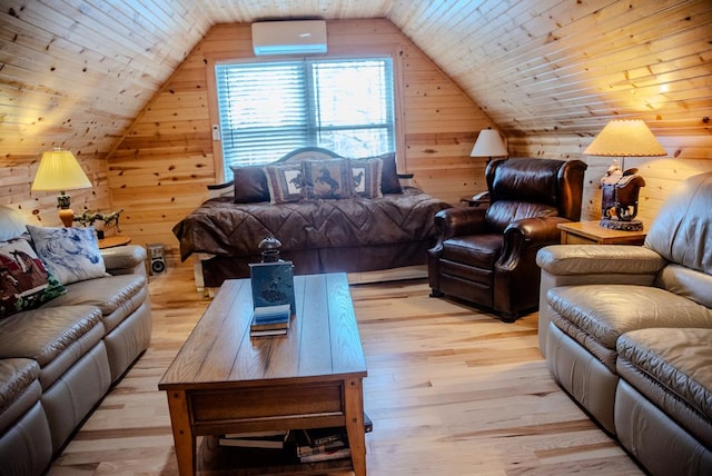 living room featuring a wall unit AC, wood walls, and light wood-style flooring