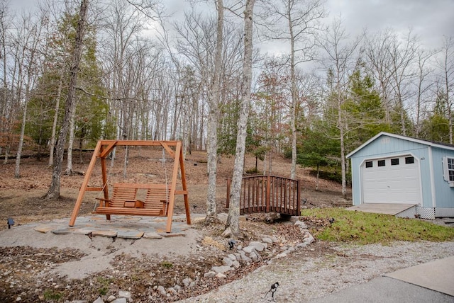 view of yard with a garage and an outdoor structure