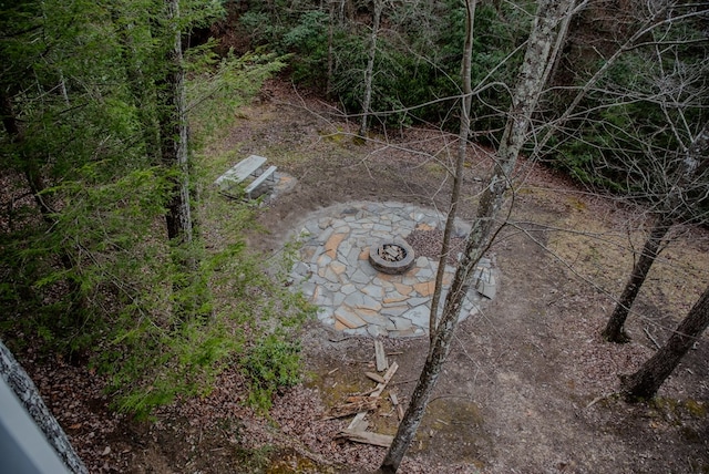 exterior space with an outdoor fire pit and a patio