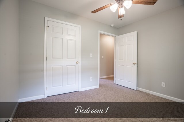 unfurnished bedroom featuring light carpet, baseboards, and a ceiling fan