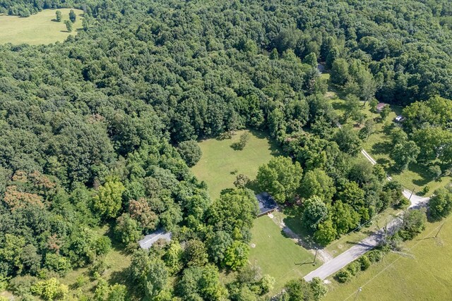 aerial view featuring a wooded view