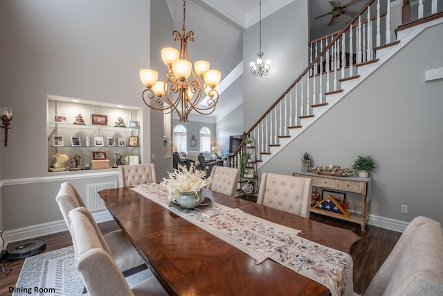 dining room featuring baseboards, a high ceiling, visible vents, and dark wood-style flooring