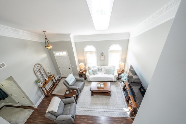 living room featuring dark wood-style flooring, plenty of natural light, and baseboards