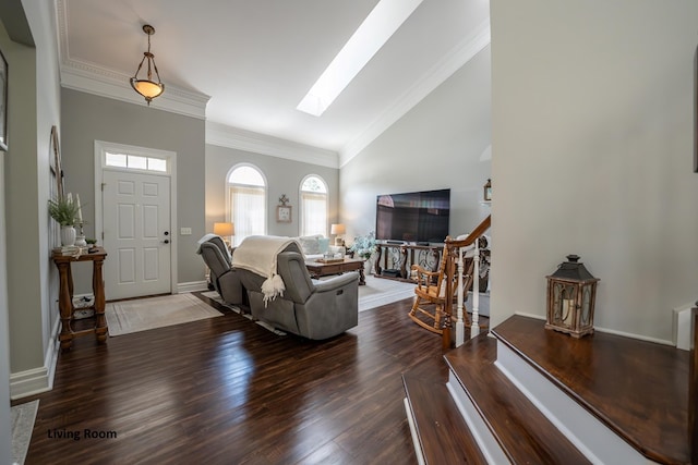 living area with dark wood-type flooring, a skylight, baseboards, stairs, and crown molding