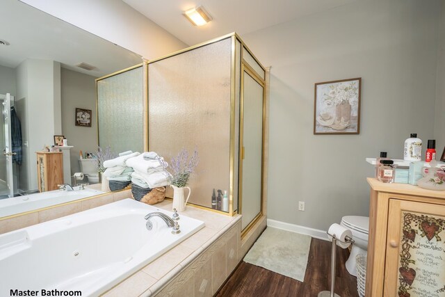 full bath featuring a garden tub, toilet, wood finished floors, visible vents, and a stall shower