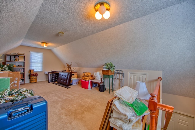 game room featuring lofted ceiling, carpet floors, and a textured ceiling