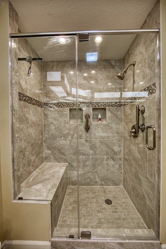 full bathroom with a stall shower