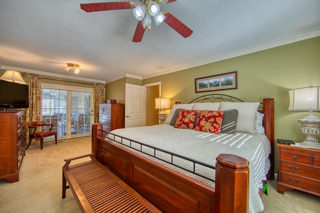 bedroom with ornamental molding, light colored carpet, a textured ceiling, and a ceiling fan