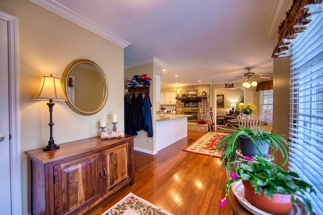 corridor featuring dark wood finished floors and crown molding