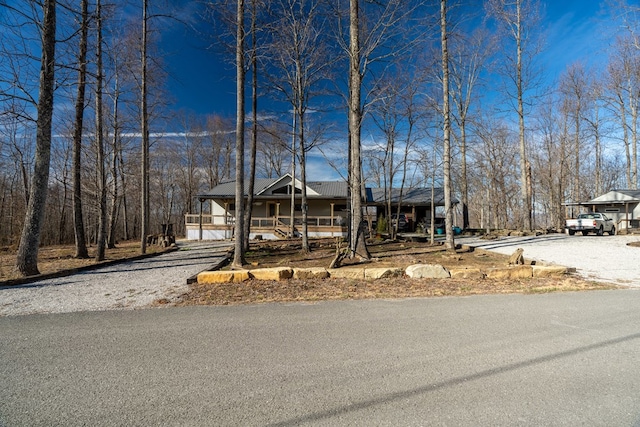 view of front of home with a porch and driveway