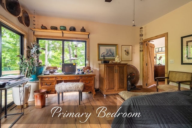 office space with plenty of natural light and wood finished floors