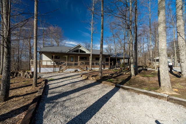 view of front of home with metal roof and a porch