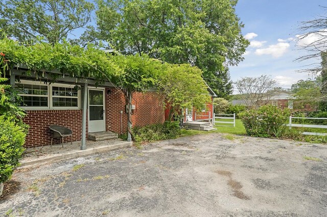 exterior space with entry steps and fence