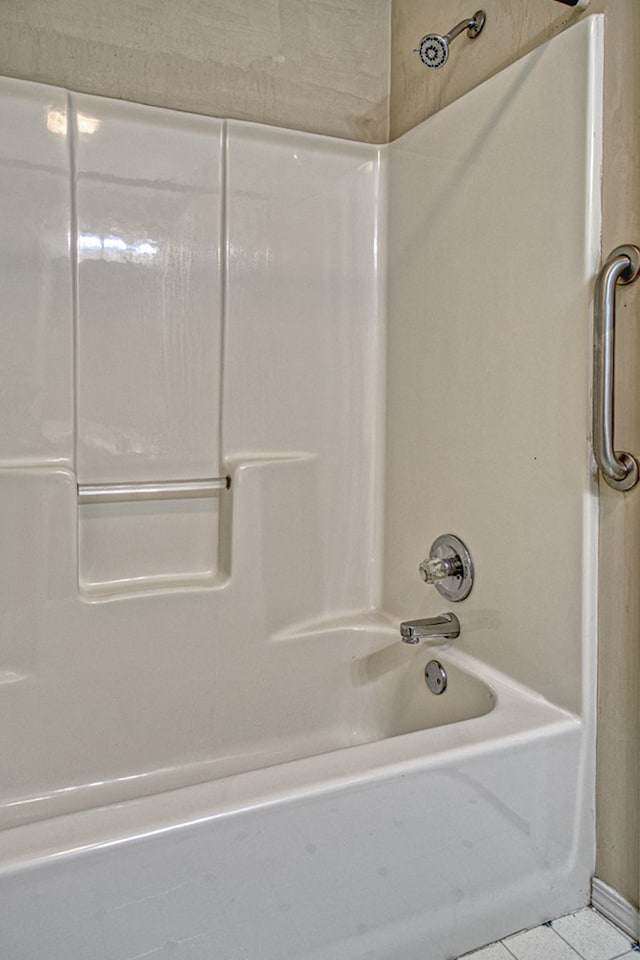 bathroom featuring tile patterned floors and shower / bathing tub combination