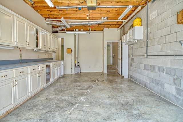 interior space featuring concrete block wall