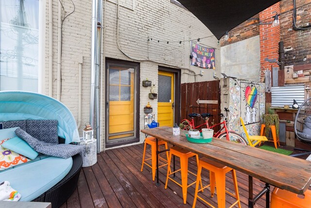 wooden terrace featuring outdoor dry bar