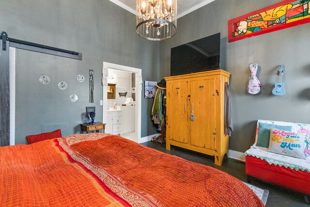 bedroom with baseboards, a barn door, an inviting chandelier, and crown molding