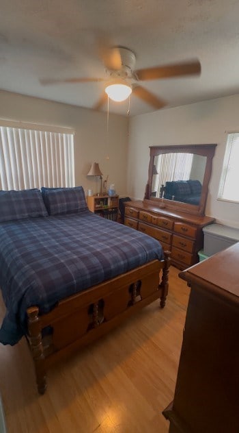 bedroom featuring ceiling fan and light wood finished floors