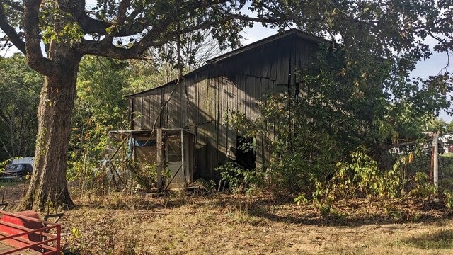 view of home's exterior featuring an outbuilding