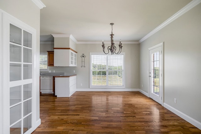 unfurnished dining area with dark wood-style floors, a notable chandelier, and baseboards