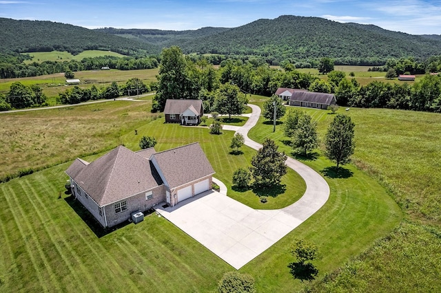 birds eye view of property featuring a mountain view and a rural view