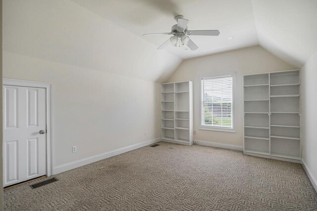 bonus room featuring lofted ceiling, visible vents, a ceiling fan, carpet flooring, and baseboards