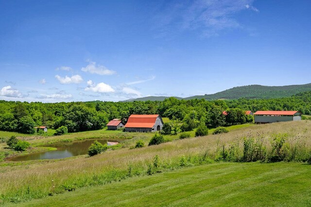 mountain view featuring a water view and a forest view