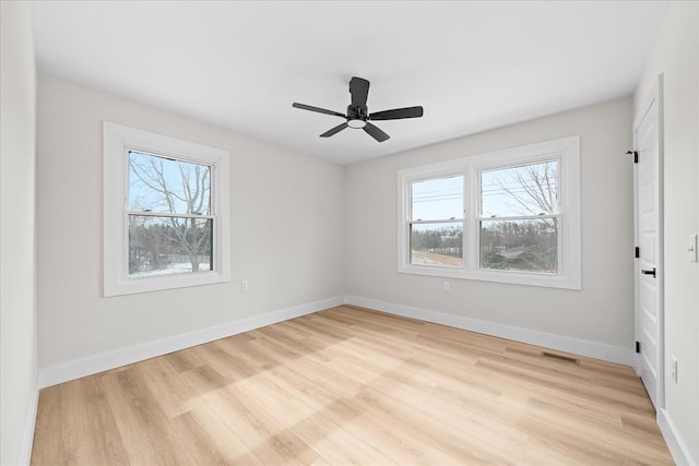 unfurnished bedroom with multiple windows and baseboards