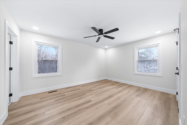 unfurnished bedroom featuring light wood-type flooring, visible vents, baseboards, and recessed lighting