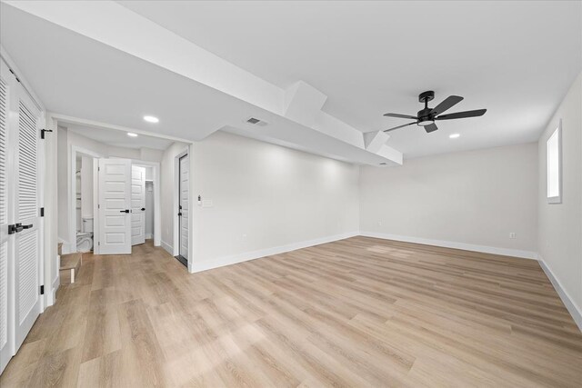 empty room with visible vents, recessed lighting, light wood-type flooring, and baseboards