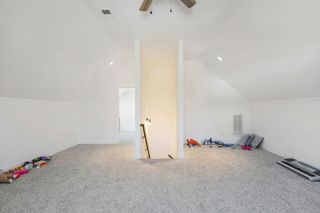 additional living space featuring lofted ceiling, a ceiling fan, visible vents, and carpet flooring