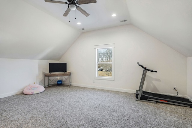 exercise room featuring lofted ceiling, baseboards, visible vents, and carpet