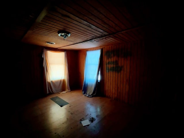 empty room featuring wood ceiling