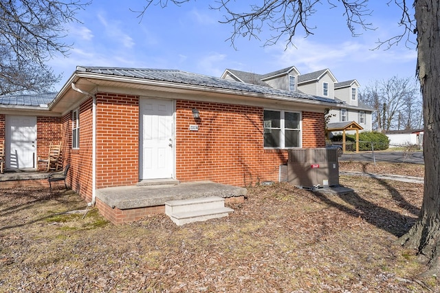 exterior space with brick siding