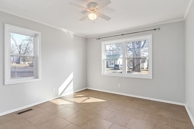 unfurnished room featuring baseboards, ceiling fan, visible vents, and crown molding