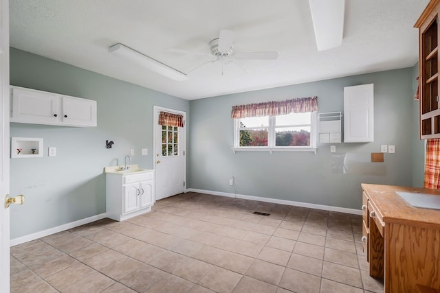 washroom with washer hookup, a sink, visible vents, a ceiling fan, and cabinet space