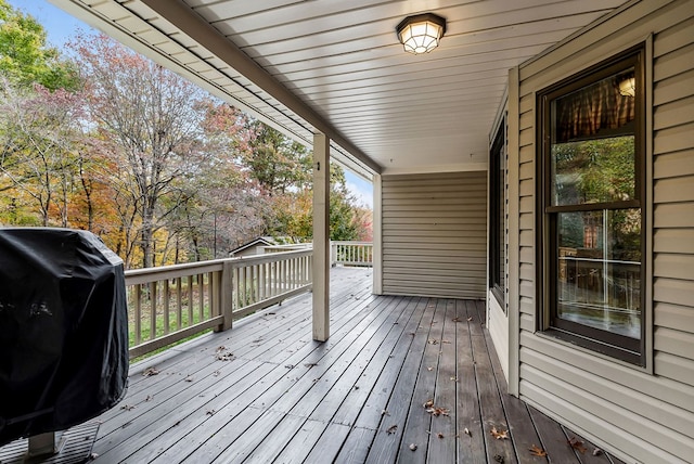 wooden deck featuring area for grilling