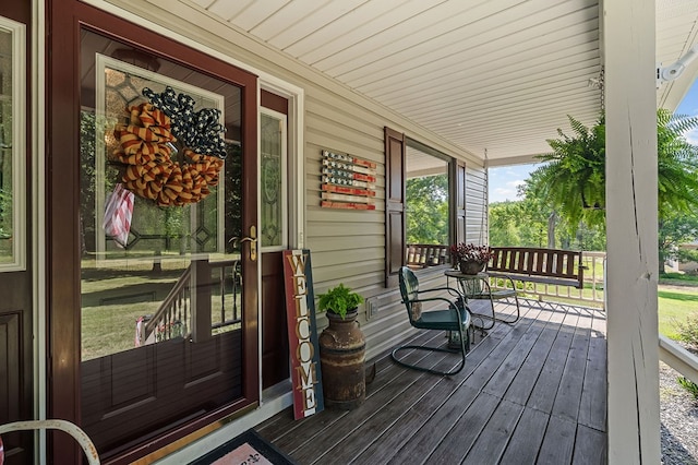 wooden terrace with a porch