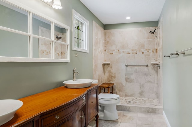 full bath featuring toilet, a stall shower, tile patterned flooring, and vanity