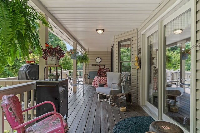 wooden terrace with a porch