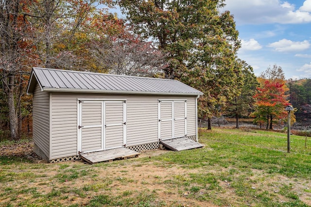 view of shed with fence