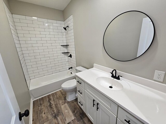 bathroom with vanity, tub / shower combination, wood finished floors, and toilet