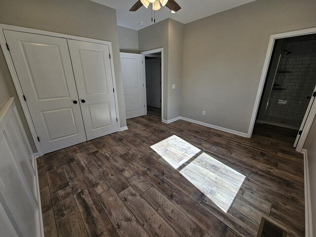 unfurnished bedroom with visible vents, baseboards, a ceiling fan, dark wood-style floors, and a closet