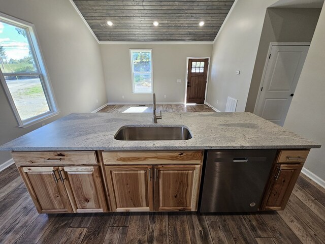 kitchen with dishwasher, light stone counters, a sink, and a center island with sink