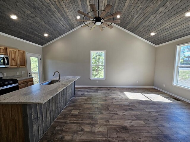 kitchen featuring a center island with sink, wood ceiling, stainless steel microwave, crown molding, and a sink