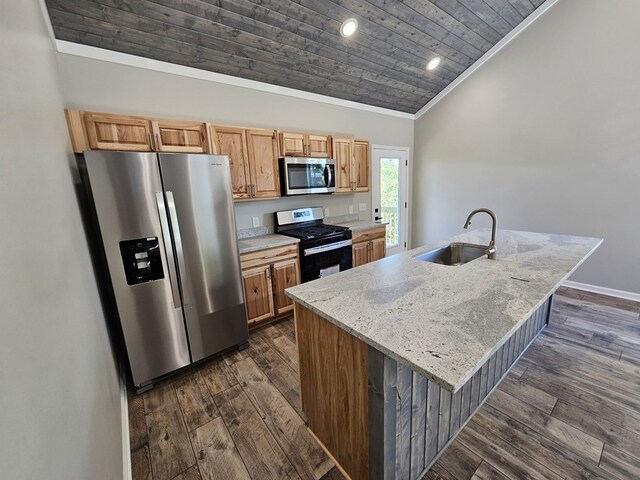 kitchen featuring a center island with sink, appliances with stainless steel finishes, vaulted ceiling, a sink, and wooden ceiling